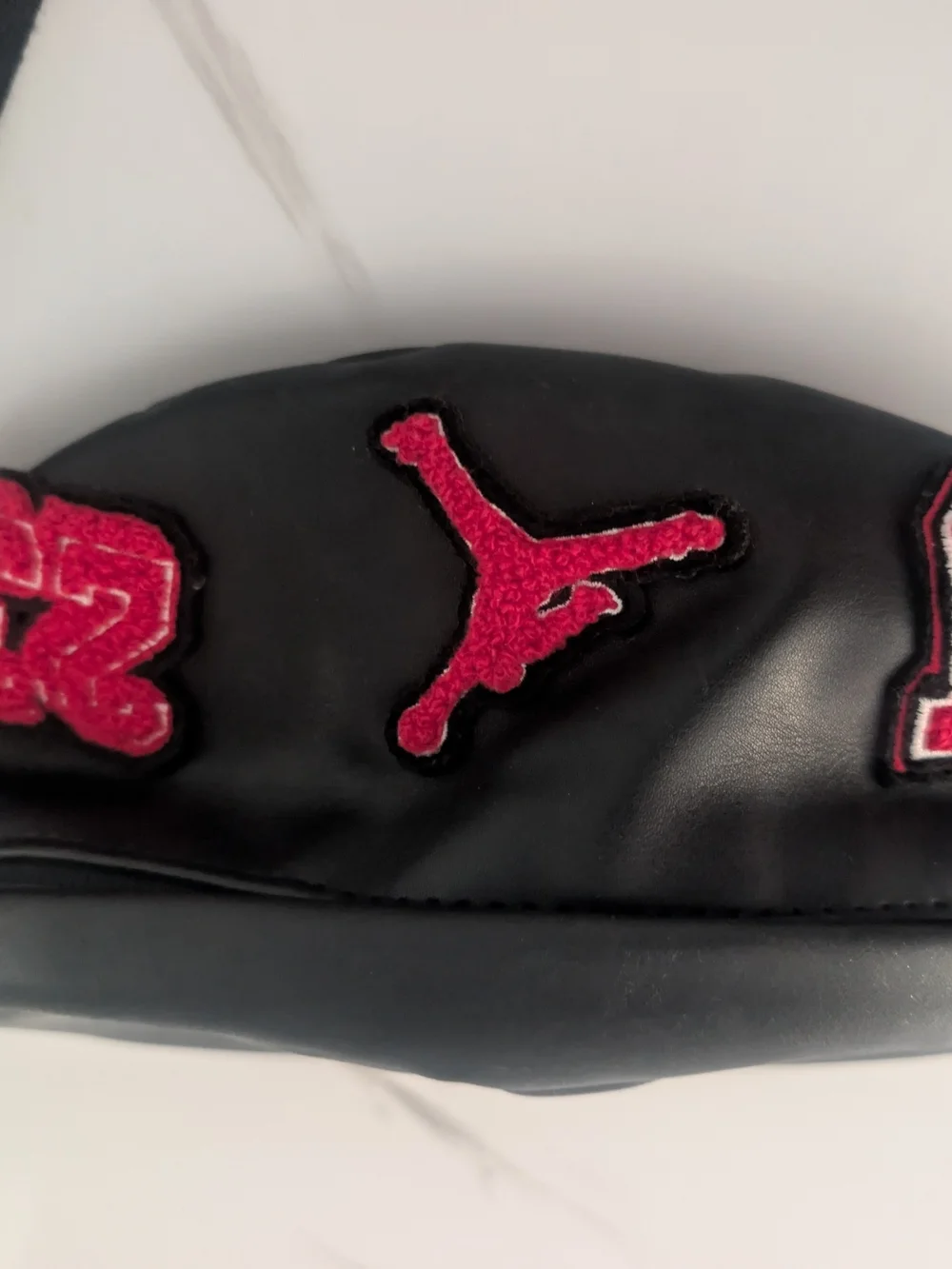Nike Black Sling Bag with Red Logo Patch